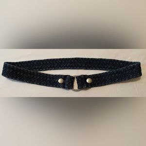 Weaved denim belt with grommets. Length 36in. Width 1.5in.